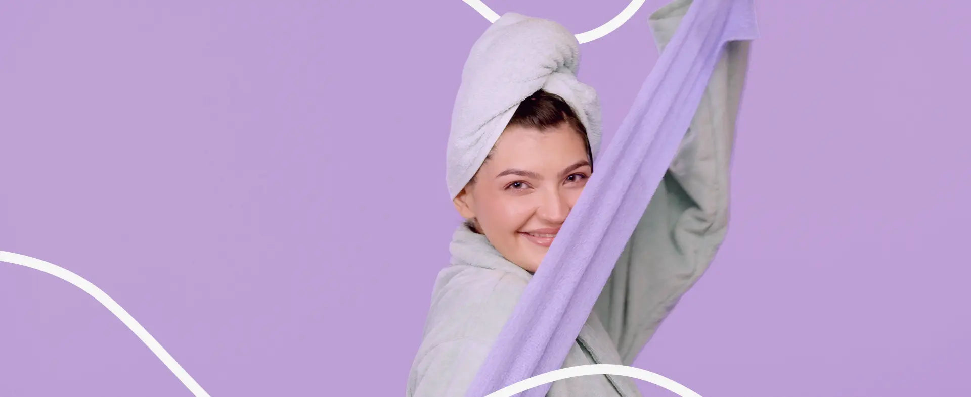 Woman holding a purple flexi cloth against a light purple background